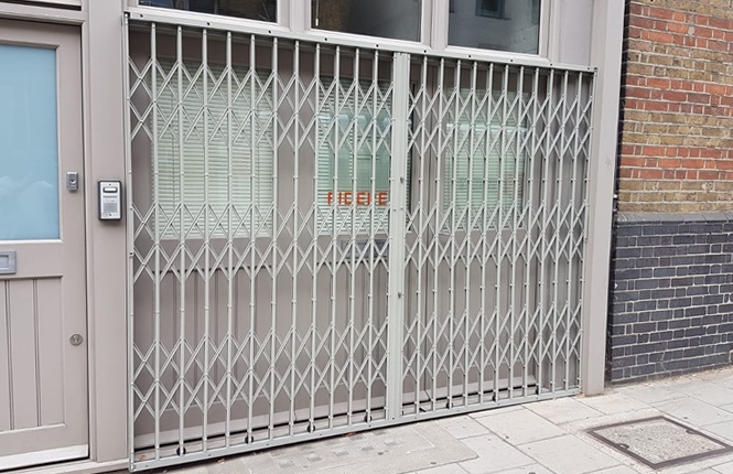 RSG1000 high security retractable grilles securing external front of offices near Waterloo.