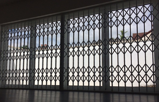 RSG1000 retractble grilles fitted on a large patio door of a residential flat in Northwood, Greater London.