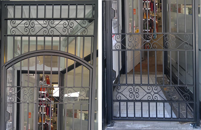 RSG3000 wrought iron gate and overhead panel with scrolls on shop entrance in London city.