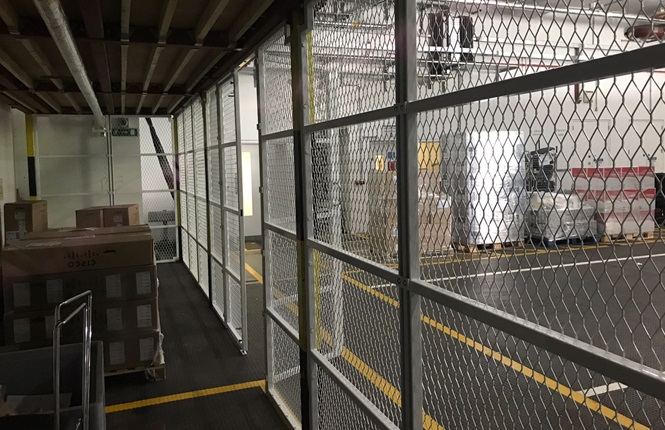  RSG4000 security enclosures providing a security area within warehouse.