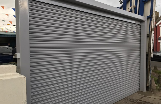 RSG5000 solid steel security shutter with Goal Post fitted to a carwash company in Harrow.