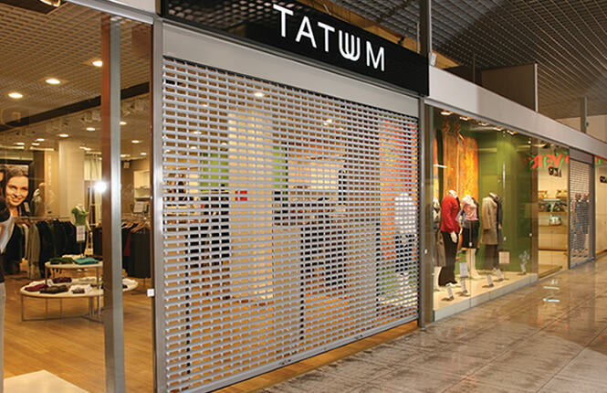 RSG5600 shop front shutter securing retail outlet Tatum in Brent Cross shopping centre.