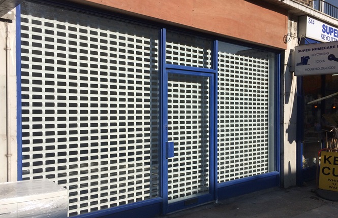 RSG5600 punched security roller shutter installed on a new retail shop in Hackney.