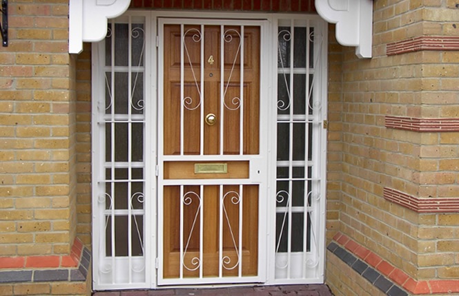 RSG3000 security door gate with side panels and scrolls.